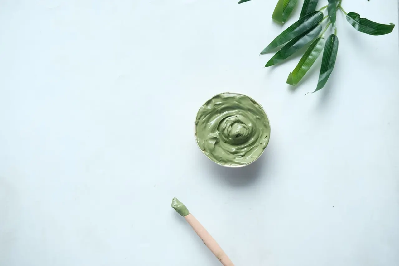 Natural cosmetic creams and ingredients arranged on a table